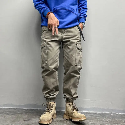 Solto masculino cor sólida grande bolso botão carga calças moda homem novo clássico rua casual ligar um dos pés calças masculinas