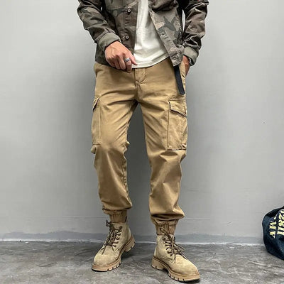 Solto masculino cor sólida grande bolso botão carga calças moda homem novo clássico rua casual ligar um dos pés calças masculinas
